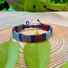 Become a fashion trendsetter with our colorful striped and blue as base color unisex macrame bracelet! Made with high quality polyester waxed thread, this surfer-inspired bracelet is perfect for adding a vibrant color to any outfit. Handmade with care, this bracelet has an adjustable sliding clap to fit any wrist size, making it the perfect accessory for both men and women. Whether you're hitting the beach or just want to add a touch of boho style to your look, this bracelet is sure to turn head Macrame Gift, Thread Bracelet, Thread Bracelets, Thread Jewellery, Bracelet Blue, Macrame Bracelet, Macrame Bracelets, Boho Stil, Bracelet Handmade