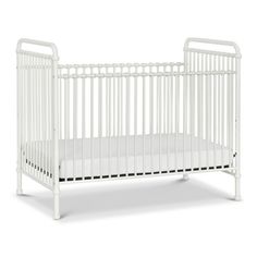 a white crib on a white background with the bottom rail extended to the side