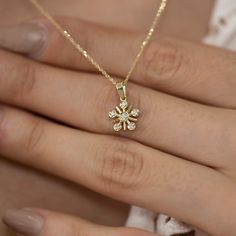 Features Yellow gold and white diamond Material: Solid Gold (not gold plated or gold filled) Available Gold Color: Yellow gold, rose gold and white gold Karat: 14 K (585) Number of Stones: 6 Total CTW: 0.07 Ctw Diamond color: F-G Color Gold grams: 2.10 gr Chain length: approximately 16.5 in / 42 cm Available with or without chain Made to order Available in 4 different chain lengths: 42 cm (16.5 in), 46 cm (18 in), 47 cm (18.5 in) or 49 cm (19 in). Model wears the 42 cm length. As with all of our Daily Wear Diamond Pendant Set, Diamond Jewelry With Flower Charm, 14k Gold Jewelry With Flower Charm For Anniversary, Diamond Pendant With Flower Charm, Rose Gold Diamond Jewelry In Flower Shape, Rose Gold Jewelry With Diamond Accents, Flower Shape, Rose Gold Flower-shaped Jewelry With Diamond Accents, Rose Gold Diamond Flower Shaped Jewelry, Dainty Diamond Jewelry With Flower Charm