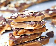 a stack of chocolate and almond bars on a table