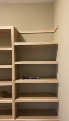 empty shelves in the corner of a room