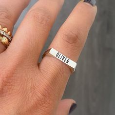 "This rectangular shaped traditional signet style ring is composed of 14K solid gold & can be finished with any name, word, initials, Roman numerals or monogram initials desired. This ring is entirely solid (NOT hollowed out on the inside) making is also possible for gemstone setting. NOTE: Please indicate the font style for engraving desired in the 'Note to Seller' section upon checkout. We will also gladly send a mock-up rendering of the engraving prior to purchasing the item by kindly sending Silver Engraved Nameplate Ring For Promise, Sterling Silver Open Band Signet Ring Gift, Luxury Engraved Open Band Ring With Polished Finish, Polished Finish Engraved Open Band Ring, Open Band Polished Signet Promise Ring, Rectangular Signet Ring With Engraving Option, Open Band Signet Promise Ring With Polished Finish, Signet Open Band Ring For Promise, Rectangular Signet Ring With Engraving Option For Gift