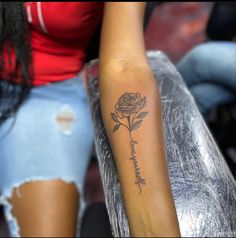 a woman's arm with a rose tattoo on it and the words, i love you