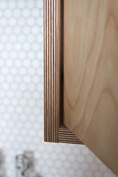 a close up view of a wooden cabinet door