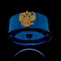 "Celebrate his accomplishments with this stunning Blue Tungsten Two Headed Eagle Wedding Ring, The double-headed eagle found on a grave may be a masonic symbol, associated with Scottish Rite Masonry, or as a symbol of the Orthodox Church (in particular Greek Orthodox). In the Orthodox Church, the double-headed eagle was the official emblem of the Christian Greco-Roman Empire as it developed after Emperor Constantine moved the centre of the Empire from Rome to the small town of Byzantium, which h Luxury Blue Rings With Polished Finish, Luxury Blue Signet Ring, Perfect Gift, Luxury Blue Signet Ring As A Gift, Blue Engraved Ring With Polished Finish As Gift, Blue Engraved Ring With Polished Finish, Luxury Blue Signet Ring For Gift, Blue Luxury Signet Ring As Gift, Blue Polished Signet Ring For Wedding, Blue Round Signet Ring For Weddings