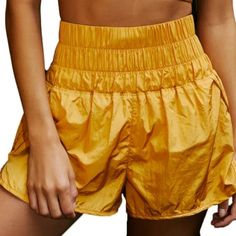 Speed Up Or Slow Down In These Breezy, Warm-Up Style Running Shorts, Featuring A Boldly Smocked Waistband With A High-Rise Silhouette And Split Hem. Fit: Pull-On Style Shorts With A Fitted, Stretchy Waistband And Relaxed Bottom Features: High-Rise Smocked Waistband That Holds You In, Curved Hemline, Back Key Pocket Why We <3 It: The Perfect Sporty Shorts For Everything From Exercise To Daily Errands. Fp Movement A Destination For Life Well-Lived, Free People Movement Offers Performance-Ready Act High Waist Nylon Athletic Shorts For Summer, Athleisure Shorts With Elastic Waistband For Summer, Summer High Waist Nylon Athletic Shorts, Stretch Pajama Shorts With Pockets For Summer, Trendy Elastic Summer Bottoms, Stretchy Pajama Shorts With Pockets For Summer, Trendy Elastic Fit Short Bottoms, High Waist Nylon Shorts For Summer, Spring High-waist Athletic Shorts With Elastic Waistband