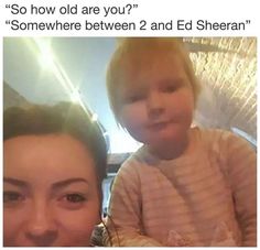 a woman holding a baby in her arms with the caption he looks like ed sheran more than ed sheran