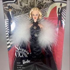 the barbie doll is dressed in black and white