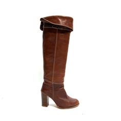 Vintage 1970s brown leather over the knee logo fabric heeled boots by Zodiac. Features brown leather uppers, rounded toe, over-the-knee rise, fold over tops, buckle strap at top of vamp, full logo fabric lining, pull on style, and column heel. Very good vintage condition with light overall wear. Made in the USA.   Heel to toe (inside shoe): 9.25 inches  Ball of foot (bottom of sole): 3.125 inches  Heel height: 3.75 inches  Shaft height: 18 inches  Circumference: 14.25 inches  Size 6.5 Knee Boots Brown, Campus Fashion, Brown Wedge Boots, Inside Shoes, Boots Brown, Fashion Fall, Brown Leather Boots, Wedge Boots, Vintage Brown