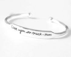 Personalized Cuff Bracelet Solid 925 Sterling Silver Cuff Bracelet Bangle, Text Message Engraved Bracelet for men and women All our designs are very attractive. Material: 925 Sterling Silver Purity : 925 Parts Per 1000 Ring Size: Adjustable Style: Bangle Brand: Handmade Ring You will receive a Bracelet like the one in the pictures. This Bracelet have 925 Stamp. Suitable for use in everyday situations, or can also be used as a gift. Unique design will make a special attraction for the wearer. I m Elegant Silver Cuff Bracelet For Mother's Day, Personalized Silver Bangle, Hand Stamped Sterling Silver Bracelets For Mother's Day, Mother's Day Hand Stamped Sterling Silver Bracelets, Adjustable Sterling Silver Cuff Bracelet As Gift, Customizable Silver Bangle Bracelet, Silver Hand Stamped Bangle As A Gift, Engraved Silver Bracelets For Mother's Day, Sterling Silver Cuff Bracelet Bangle As Gift