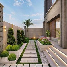 an outdoor garden with grass and plants in planters on either side of the walkway