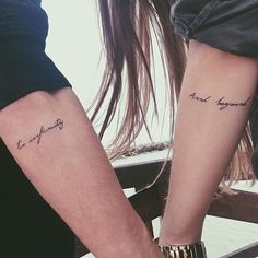 two people holding hands with tattoos on their arms that say i'm always there