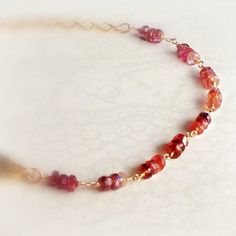 This red spinel bracelet handcrafted by Jewelry By Carmal is made of red spinel faceted gemstones, 14K gold filled: chain, findings and lobster claw closure. This bracelet measures to 7 1/2 inches in length. What a Perfect gift for that special someone for Valentine's Day! All of our jewelry is unique and custom designed. Most of our jewelry can easily be resized. If there is a piece of jewelry that you are interested in, but would like some changes made, please do not hesitate to contact us. We Red Faceted Rondelle Jewelry, Red Briolette Gemstone Beads Jewelry, Red 14k Gold-filled Gemstone Jewelry, Faceted Rondelle Ruby Jewelry, Faceted Ruby Rondelle Jewelry, Red Faceted 14k Gold Jewelry, Handmade Red Rondelle Jewelry, Red Garnet Jewelry With Faceted Beads, Valentine Gifts Jewelry