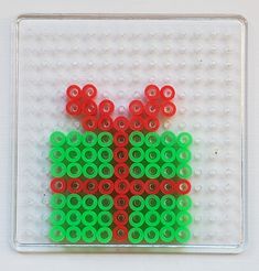 a close up of an object made out of legos on a white surface with red, green and blue circles