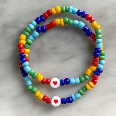 "This hand-crafted elastic stretch bracelet is the perfect way to show your love and support for a friend or family member who has autism or even for yourself. Each bracelet is made-to-order, so any changes regarding size, color, or even word customization can easily be made (please specify these changes in notes or message me directly). Reborn Rebel bracelets are a fun way to carry your favorite words or messages with you throughout your day. Each order includes a free sticker and arrives quick Bracelet Design Ideas, Pokemon Bracelet, Best Friend Bracelets, Beaded Heart, Bead Charms Diy, Diy Bracelets Easy, Easy Diy Jewelry