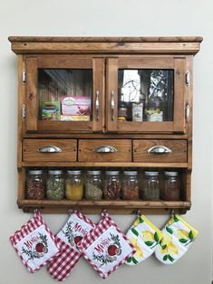 a wall mounted spice rack with spices on it