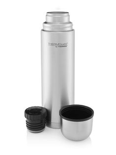 thermos stainless steel insulated water bottle is shown with its lid open and two cups beside it