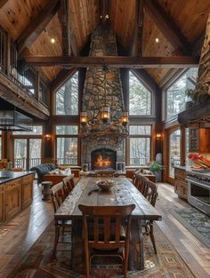 a large wooden table sitting in front of a stone fireplace