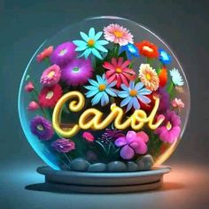 a glass ball filled with flowers and the word carol written in neon letters on it