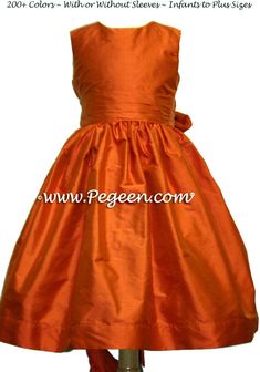 an orange dress on a mannequin dummy