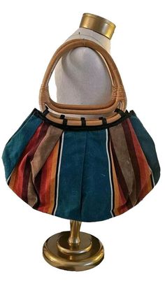 Vintage Large Boho Shoulder Bag Bamboo Handles Colorful- Purses, Satchels, Bags This is a vintage boho shoulder bag with bamboo handles. The bag is made of colorful material and falls under the category of vintage accessories. It is in great vintage condition. There are a couple of discolorations on the fabric. Very slight. And a few Penn marks in the interior of the purse. See pictures. Email me with questions. It's a large bag. Approx 22 tall by 22 wide. Handles are big enough to carry on the shoulder with the arm through the handles. Retro Multicolor Hobo Tote Bag, Retro Multicolor Tote Hobo Bag, Vintage Canvas Shoulder Bag For Summer, Bohemian Shoulder Bag With Bamboo Handle For Shopping, Vintage Multicolor Satchel With Leather Handles, Retro Multicolor Hobo Shoulder Bag, Retro Multicolor Hobo Bag For Travel, Casual Multicolor Hobo Bag With Braided Handles, Multicolor Bohemian Satchel For Shopping