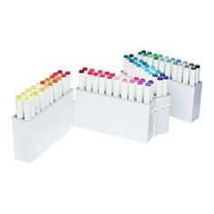 two white boxes with markers and pens in them