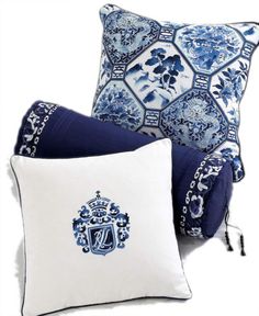 two pillows with blue and white designs on them