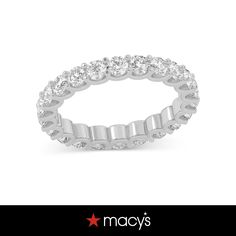 a white gold ring with rows of round diamonds