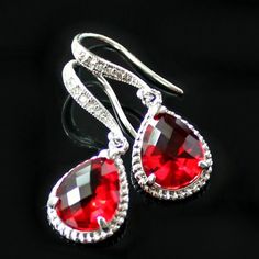 "These beauties are standouts! Perfect for that special occasion! Elegant  jeweled, french earrings carry stunning, red teardrop crystals with a silver rope trim. The crystal detail on these earrings give them such a classy and sophisticated feel. * Sterling Silver-Plated French Earrings * 16K Gold-Plated French Earrings * Swarovski Crystal Detailing * Red Faceted Crystal- 19 x 12mm(3/4x1/2\") including rope trim * Tarnish Resistant * Earring Length- 32mm(1 1/4\") The necklace is available in a separate listing. These earrings come in an organza bag and gift box." Teardrop Earrings For Valentine's Day Party, Red Teardrop Dangle Earrings For Formal Occasions, Red Dangle Teardrop Earrings For Formal Occasions, Red Dangle Crystal Earrings For Anniversary, Red Drop Crystal Earrings As Gift, Elegant Red Drop Crystal Earrings, Red Crystal Earrings For Gift, Red Drop Earrings For Formal Occasions, Red Drop Crystal Earrings For Anniversary