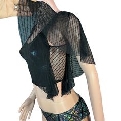 Unleash your inner star with our dazzling Metallic Crop Tank with Mesh Flutter Sleeves. Perfect for raves, festivals, aerial performances, pole fitness, or as a statement everyday top, this unique piece combines edgy fashion with ultimate comfort.Key Features: Eye-Catching Design w/ metallic Fabric: Made from high-quality, metallic material that shines with every movement, ensuring you capture the spotlight wherever you go. Mesh Flutter Sleeves: Delicate, airy mesh flutter sleeves add a touch of whimsy and elegance, creating a dynamic contrast with the metallic fabric.Comfortable and Flattering Fit Cropped Length: The stylish cropped cut sits perfectly above the waist, flattering your figure and pairing effortlessly with high-waisted bottoms. Stretch Fabric: Crafted with a blend of stretch Gothic Mesh Top For Spring Party, Spring Gothic Party Mesh Top, Spring Party Gothic Mesh Top, Gothic Tops For Summer Festivals, Edgy Mesh Crop Top For Party, Fitted Gothic Mesh Top For Night Out, Gothic Mesh Top For Night Out, Edgy Mesh Top For Party, Black Gothic Mesh Top For Night Out