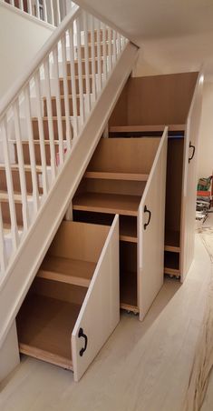 the stairs are being built into the wall next to the closet under the stair case