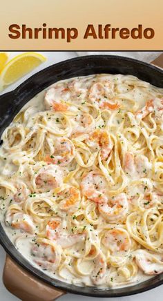 a skillet filled with pasta and shrimp