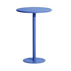 a small blue table with a round base