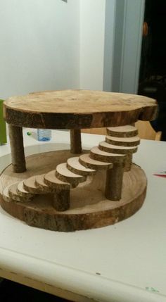 a wooden table with steps on top of it