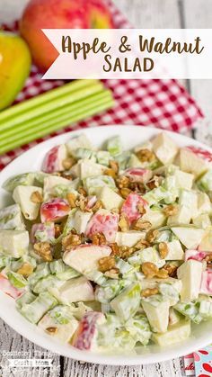 an apple and walnut salad on a white plate with apples in the background text overlay reads, apple & walnut salad