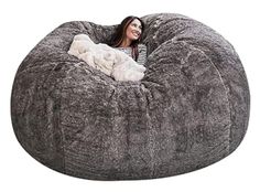 a woman sitting in a large bean bag chair