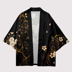 Floral Fantasy: Step Out in a Storybook with Our Black Crane Kimono Jacket Drape yourself in the enchanting elegance of the Black Floral Kimono Jacket, a garment that seamlessly blends ancient tradition with contemporary fashion flair. Crafted for the discerning fashionista, this kimono jacket features a luxurious black backdrop adorned with a stunning array of golden and ivory floral patterns, intertwined with delicate pink blossoms and majestic cranes in flight. The artwork on this jacket is n Crane Kimono, Modern Kimono Dress, Small Kimono, Japanese Pants, Black Floral Kimono, Japanese Uniform, Sukajan Jacket, Japanese Socks, Modern Kimono