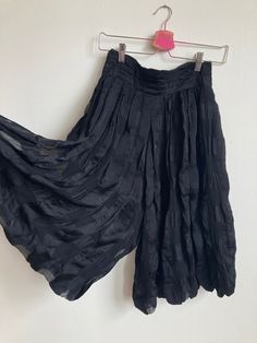 "Stunning, inky black check pattern puckered silk pleated culottes by YSL. Made in France. Leg is a balloon shape, and rise is extra high. Wide waistband, zips up in back and closes with a row of 3 buttons. Pockets at each hip. Semi-sheer and double layered.  Excellent condition.  Waist, across: 13\", 13.5\" pulled taut Rise: 18\" Inseam: 13.5\" Hip: free/open Please ask any questions before purchasing, especially concerning fit or condition. All items are vintage and in condition as described. Shipping via USPS Priority Mail unless otherwise agreed upon. All sales final, no returns- Thank You from Collecting Dust!" Summer Evening Bottoms With Pleated Waist, Black Pleated Wide Leg Culottes, Evening Full Skirt With Elastic Waistband, Evening Full Skirt Bottoms With Elastic Waistband, Pleated Silk Bottoms For Evening, Summer Evening Bottoms With Pleated Hem, Black Bottoms With Pleated Waist For Evening, Black Pleated Hem Bottoms For Summer, Evening Full Skirt Bottoms With Pleated Hem