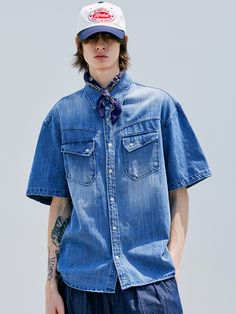 Editor's notesWashed Denim Western Shirt by KND is made of 100% cotton, providing a cool and lightweight feel. This shirt is a denim shirt with a curved-shaped yoke and slanted pocket details on the front. It features a relaxed loose fit. The fabric has undergone bleach and brush washing processes, giving it a more vintage look. The buttons used are snap buttons. It is a versatile shirt that can be styled with various outfits.- Relaxed loose fit- Two chest pockets- Slap button type- Versatile it Casual Dark Wash Shirt With Patch Pockets, Dark Wash Summer Shirt With Pockets, Indigo Short Sleeve Cotton Denim Top, Indigo Short Sleeve Denim Top, Indigo Cotton Denim Top With Short Sleeves, Summer Dark Wash Chambray Shirt, Medium Wash Summer Shirt, Distressed Collared Cotton Top, Distressed Cotton Collared Tops