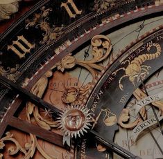 an ornate clock with roman numerals on it