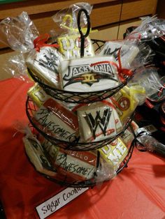 a basket filled with assorted cookies on top of a red tablecloth covered table