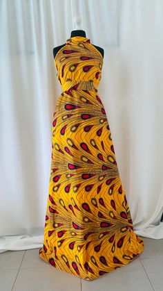 Voici une robe qui se porte de plusieurs façons, vous pouvez mettre les manches si vous le désirez ou les retirer. La ceinture est fourni avec la robe cela vous permet De marquer la taille. Cette robe vous accompagne pas seulement lors des cérémonies traditionnelle mais aussi une robe d’été en wax long et original. Mode Kimono Wax, Long Soft Robe Fruit, Yellow Ankara Fabric Maxi Dress, Model Wax, Style Casual, Casual Fashion