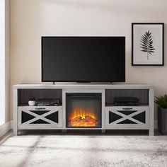 an entertainment center with a fireplace and television