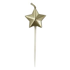 a gold star shaped cake topper on a toothpick with a white background