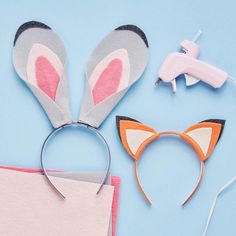 some bunny ears are next to a pair of scissors