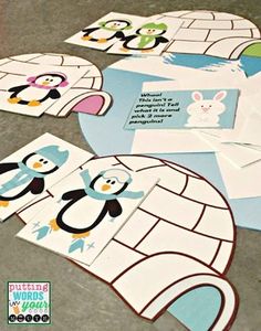 penguin and penguinie cut outs are on the floor