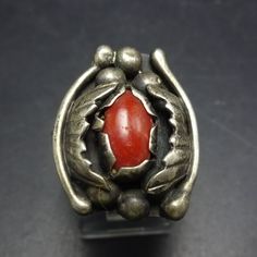 VINTAGE CORAL RING DESCRIPTION:  This exquisite ring features a cab of old red Mediterranean coral set in heavy gauge sterling silver. Applied leaves and raindrops flank the gemstone, and a band a twisted sterling silver wire bisects the split shank band. This fabulous ring will be a cherished addition to your collection of quality vintage Southwestern and Native American jewelry. MEASUREMENTS:  Ring face measures 7/8" x 3/4" RING SIZE:  8 1/4 WEIGHT:  8.5 grams SIGNED:  ƎE STERLING:  unmarked, Vintage Red Hallmarked Signet Ring, Vintage Sterling Silver Ring With Polished Finish, Collectible Red Rings With Polished Finish, Vintage Gemstone Engraved Ring Collectible, Vintage Red Jewelry With Polished Finish, Vintage Gemstone Rings For Collectors, Vintage Engraved Gemstone Ring For Collectors, Rare Collectible Ruby Ring, Vintage Collectible Gemstone Engraved Ring