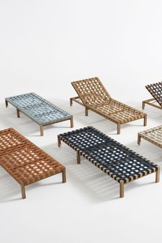 six wooden lounge chairs with different patterns on them, all in various sizes and colors