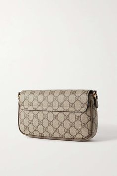 GUCCI Ophidia leather-trimmed printed coated-canvas shoulder bag | NET-A-PORTER Luxury Monogram Canvas Baguette Bag For Everyday Use, Monogram Canvas Clutch Shoulder Bag With Removable Pouch, Everyday Luxury Coated Canvas Shoulder Bag With Dust Bag, Classic Monogram Canvas Pouch Shoulder Bag, Gucci Clutch Shoulder Bag With Gold-tone Hardware, Modern Coated Canvas Bags For Everyday Luxury, Elegant Monogram Canvas Baguette Bag For Everyday Use, Gucci Pouch Bag With Detachable Strap, Elegant Monogram Canvas Baguette Shoulder Bag