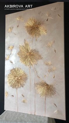 a painting with gold foil on it that has dandelions in the middle of it